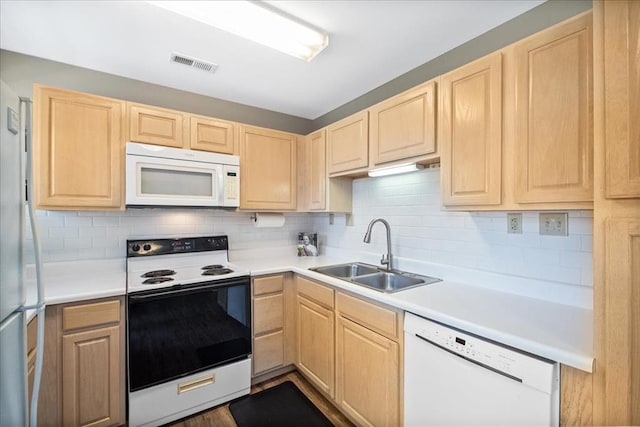 100 Jubilee Hill Dr Unit G, Wildwood, MO 63040 - kitchen featuring white appliances, light brown cabinetry, a sink, and backsplash
