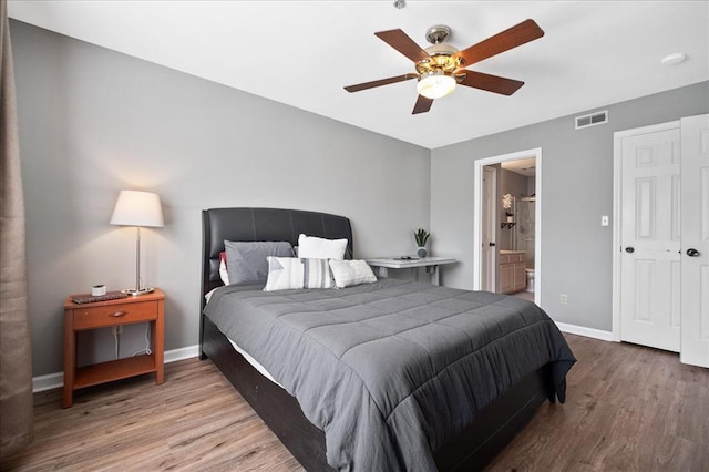 100 Jubilee Hill Dr Unit G, Wildwood, MO 63040 - bedroom with wood finished floors, baseboards, ensuite bathroom, and a ceiling fan