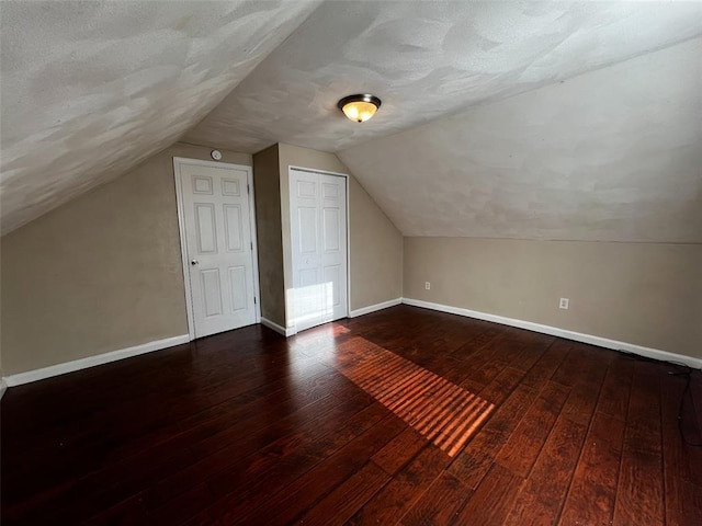 1638 Poplar St, Granite City, IL 62040 - bonus room with hardwood / wood-style flooring, baseboards, vaulted ceiling, and a textured ceiling