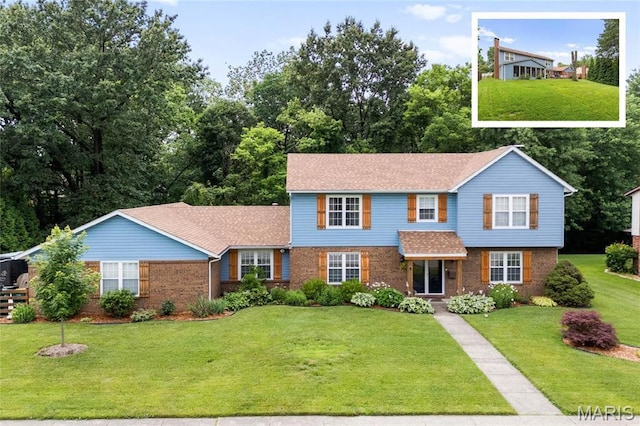1013 N Smiley St, Ofallon, IL 62269 - traditional-style house featuring brick siding, a front lawn, and roof with shingles