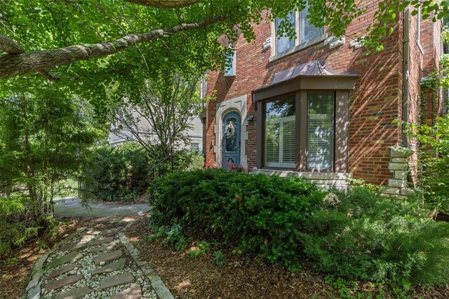 8145 University Dr, Clayton, MO 63105 - doorway to property with brick siding