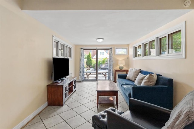8145 University Dr, Clayton, MO 63105 - living room featuring light tile patterned floors and baseboards