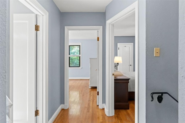 8145 University Dr, Clayton, MO 63105 - hall featuring light wood finished floors and baseboards