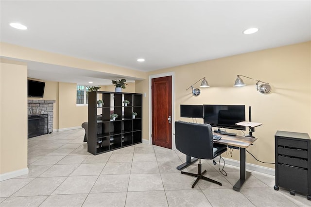 8145 University Dr, Clayton, MO 63105 - office area with tile patterned floors, baseboards, a stone fireplace, and recessed lighting