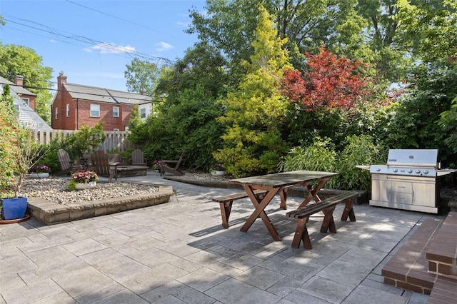 8145 University Dr, Clayton, MO 63105 - view of patio with outdoor dining space and a grill
