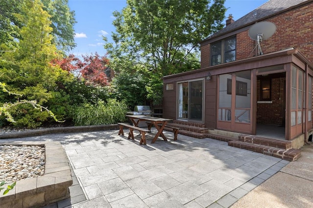 8145 University Dr, Clayton, MO 63105 - view of patio featuring entry steps and outdoor dining area