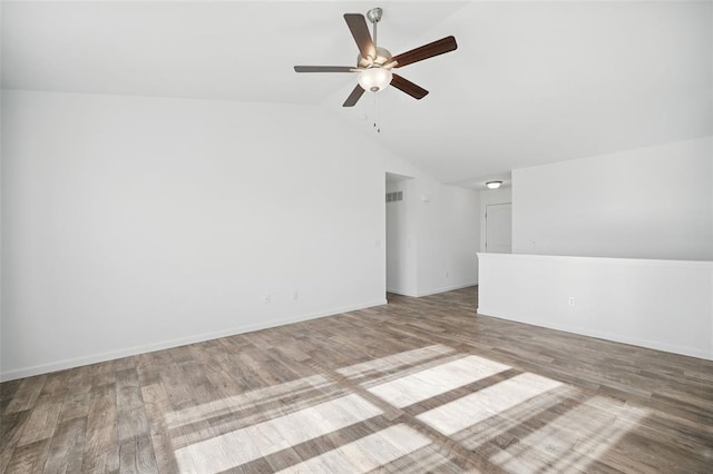 917 Gimli Ln, Wright City, MO 63390 - spare room with a ceiling fan, vaulted ceiling, wood finished floors, and baseboards