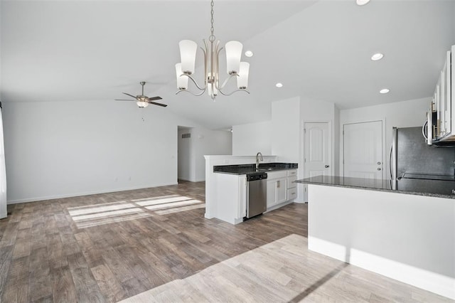 917 Gimli Ln, Wright City, MO 63390 - kitchen with appliances with stainless steel finishes, dark countertops, ceiling fan, white cabinetry, and a peninsula