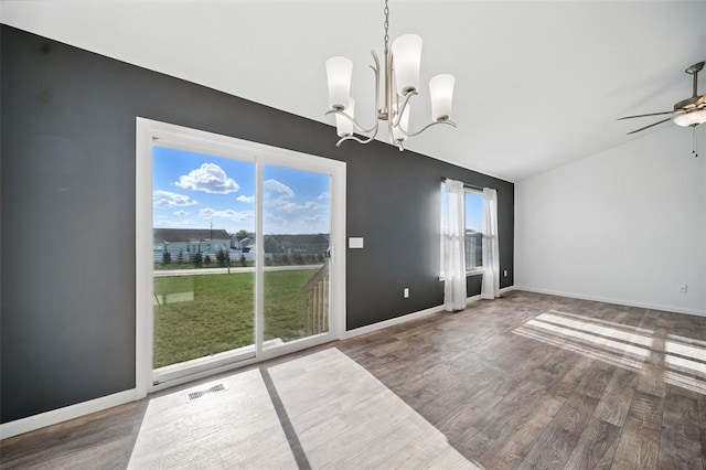 917 Gimli Ln, Wright City, MO 63390 - unfurnished dining area with wood finished floors, a chandelier, a ceiling fan, vaulted ceiling, and baseboards