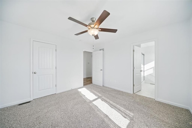917 Gimli Ln, Wright City, MO 63390 - unfurnished bedroom with light carpet, baseboards, ceiling fan, and ensuite bath