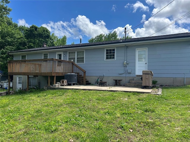 2 Graham Dr, Union, MO 63084 - back of property with a yard, a deck, cooling unit, and a patio