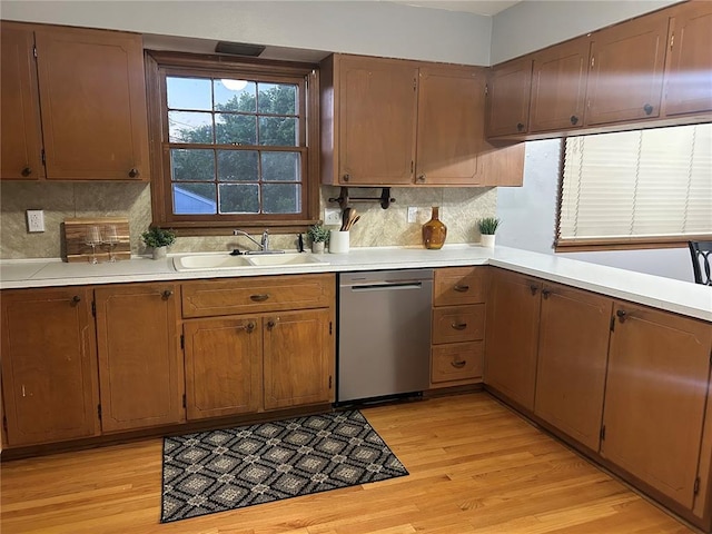 2 Graham Dr, Union, MO 63084 - kitchen featuring dishwasher, a sink, and light countertops