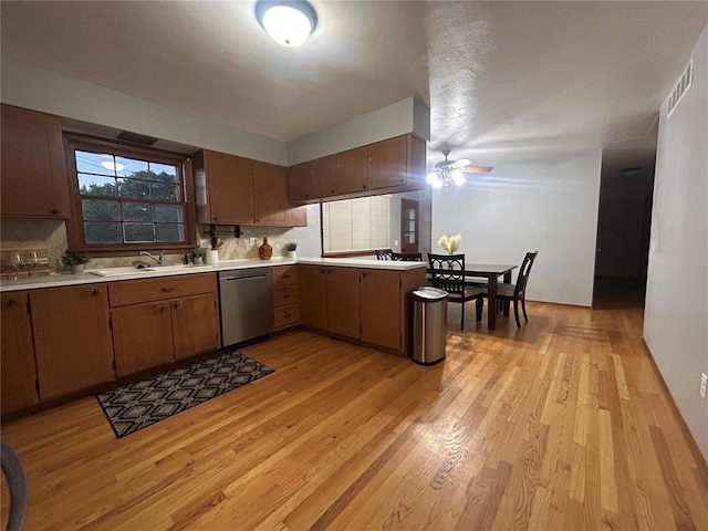 2 Graham Dr, Union, MO 63084 - kitchen with dishwasher, light countertops, tasteful backsplash, and light wood-type flooring