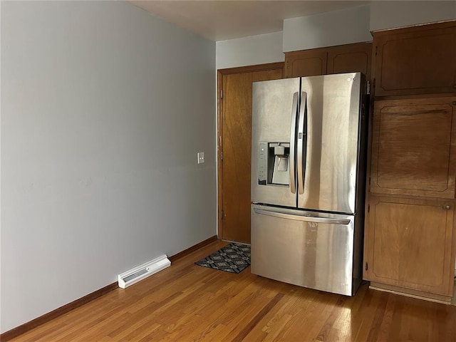 2 Graham Dr, Union, MO 63084 - kitchen featuring stainless steel refrigerator with ice dispenser, light wood-style flooring, and baseboards