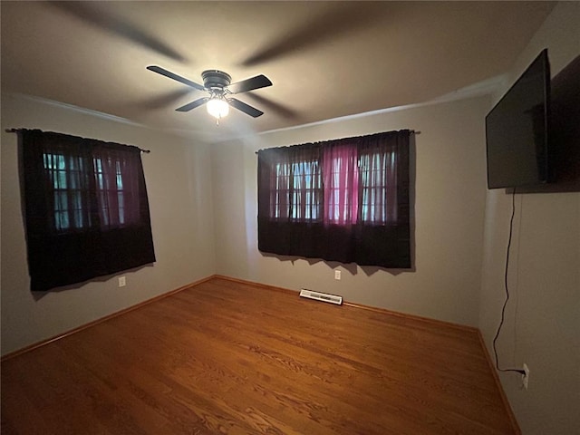 2 Graham Dr, Union, MO 63084 - spare room featuring a ceiling fan, wood finished floors, and baseboards