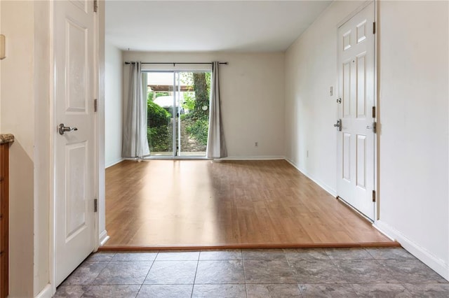 7611 Triwoods Dr Unit D, Shrewsbury, MO 63119 - empty room featuring baseboards and wood finished floors