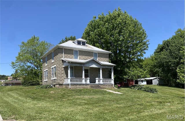 405 W 18th St, Hermann, MO 65041 - traditional style home with covered porch, a front lawn, and an outbuilding