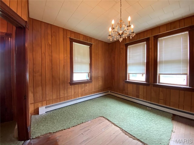 405 W 18th St, Hermann, MO 65041 - unfurnished room with a chandelier, wood-type flooring, and wooden walls