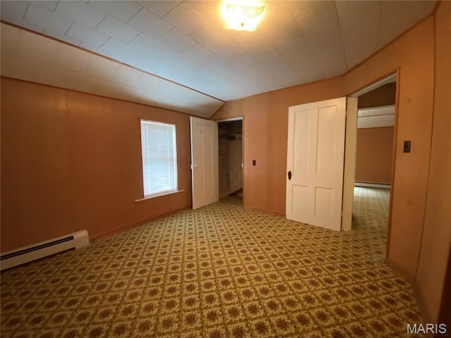 405 W 18th St, Hermann, MO 65041 - unfurnished bedroom with baseboard heating, lofted ceiling, and a closet