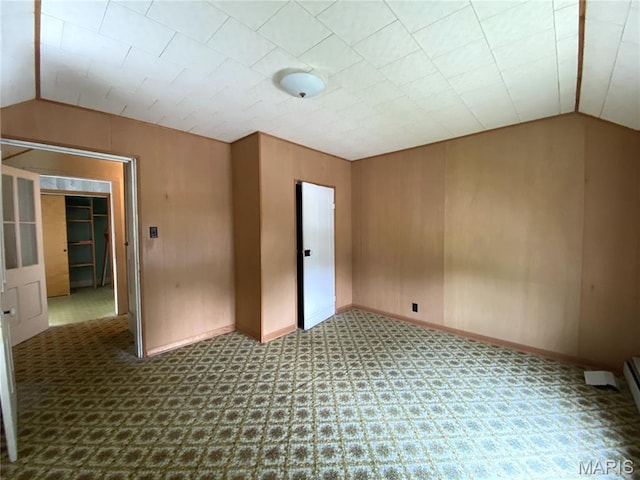 405 W 18th St, Hermann, MO 65041 - carpeted spare room with vaulted ceiling and baseboards