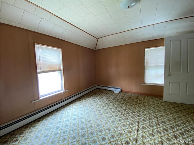 405 W 18th St, Hermann, MO 65041 - spare room featuring carpet flooring, lofted ceiling, and baseboard heating