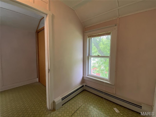 405 W 18th St, Hermann, MO 65041 - spare room with vaulted ceiling, tile patterned floors, a baseboard heating unit, and baseboards