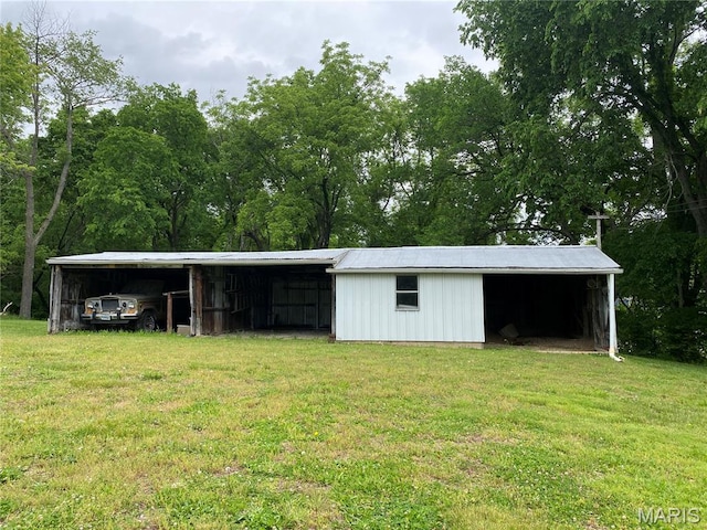 405 W 18th St, Hermann, MO 65041 - view of pole building with a yard and a carport