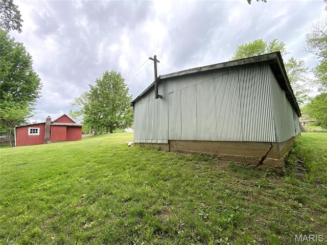 405 W 18th St, Hermann, MO 65041 - view of home's exterior featuring a yard, an outbuilding, and a pole building