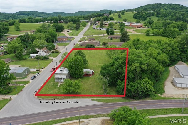 405 W 18th St, Hermann, MO 65041 - aerial view of property and surrounding area featuring a mountainous background and property boundaries highlighted