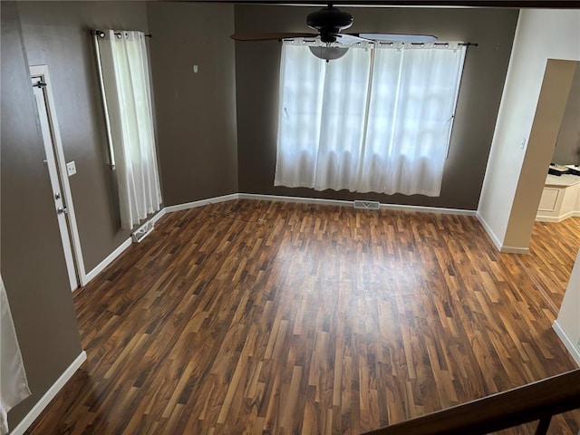 603 Capps Ave, Nokomis, IL 62075 - unfurnished dining area with a ceiling fan, wood finished floors, and baseboards