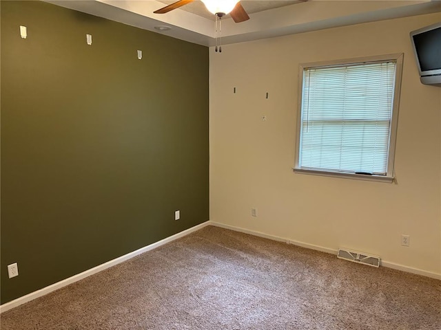 603 Capps Ave, Nokomis, IL 62075 - spare room with a ceiling fan, carpet floors, and baseboards