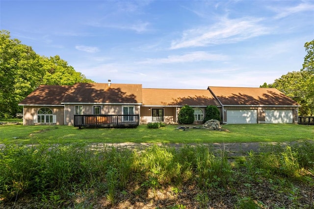 21604 Fox Dr, Carlyle, IL 62231 - back of house featuring a yard, a deck, and a garage