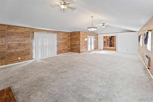 21604 Fox Dr, Carlyle, IL 62231 - unfurnished living room featuring ceiling fan, wood walls, lofted ceiling, carpet, and a wall mounted AC