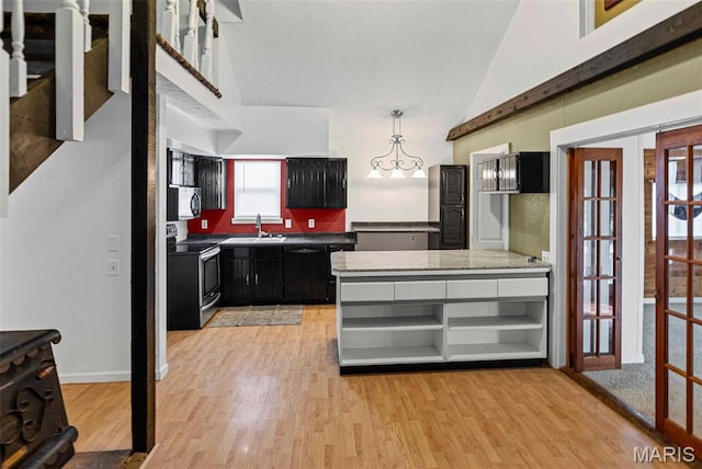 21604 Fox Dr, Carlyle, IL 62231 - kitchen with appliances with stainless steel finishes, dark cabinetry, light wood-style floors, lofted ceiling, and french doors