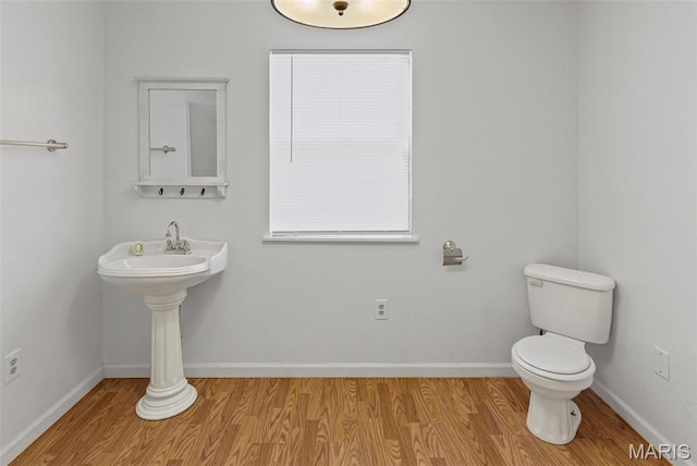 21604 Fox Dr, Carlyle, IL 62231 - half bath with wood finished floors and toilet