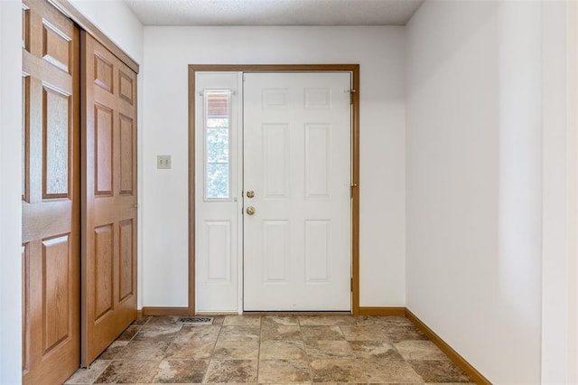 1101 Claycrest Dr, Cottleville Township, MO 63304 - foyer featuring baseboards and light stone finish flooring