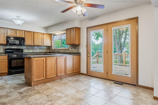 1101 Claycrest Dr, Cottleville Township, MO 63304 - kitchen with black appliances, decorative backsplash, dark countertops, a textured ceiling, and brown cabinetry