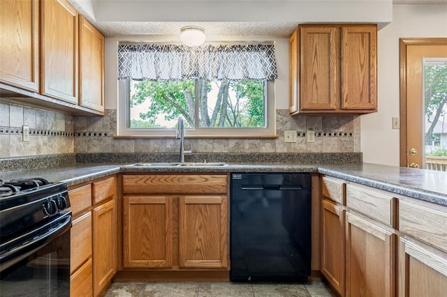 1101 Claycrest Dr, Cottleville Township, MO 63304 - kitchen featuring black appliances, a sink, healthy amount of natural light, and dark countertops