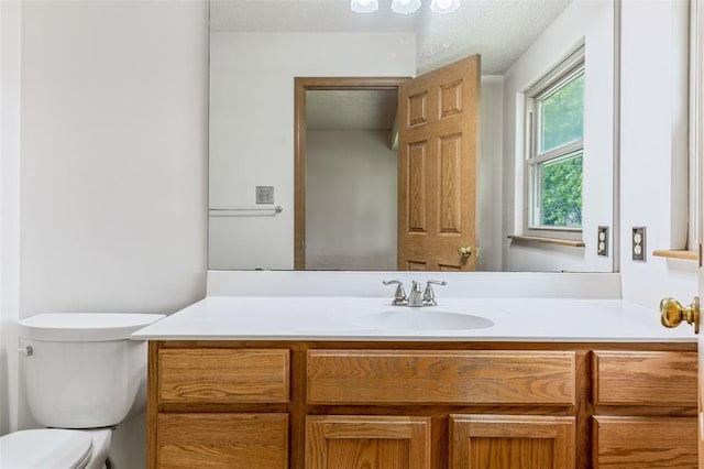 1101 Claycrest Dr, Cottleville Township, MO 63304 - bathroom featuring vanity, toilet, and a textured ceiling