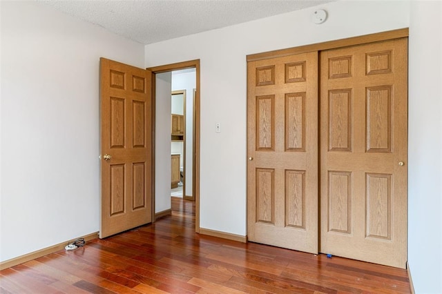 1101 Claycrest Dr, Cottleville Township, MO 63304 - unfurnished bedroom with wood finished floors, baseboards, and a closet