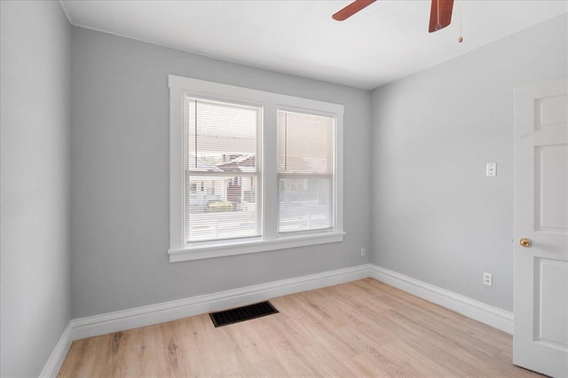 3903 Schiller Pl, Saint Louis, MO 63116 - spare room with baseboards, wood finished floors, and a ceiling fan