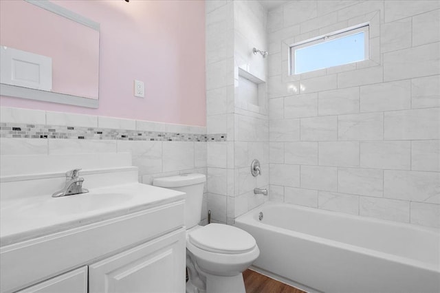 3903 Schiller Pl, Saint Louis, MO 63116 - full bath featuring toilet, tub / shower combination, vanity, wood finished floors, and wainscoting