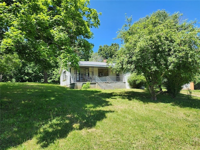 10809 Wayne Route Ff, Patterson, MO 63956 - view of grassy yard with covered porch