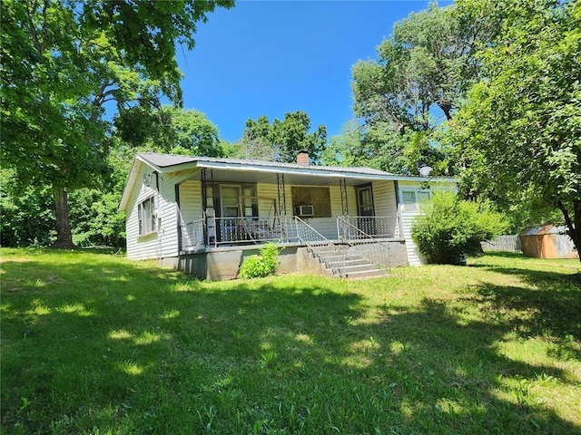10809 Wayne Route Ff, Patterson, MO 63956 - view of front of property featuring covered porch, a front yard, metal roof, and a chimney