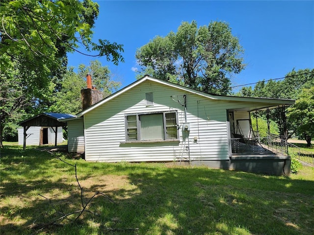 10809 Wayne Route Ff, Patterson, MO 63956 - view of side of home with a chimney and a yard