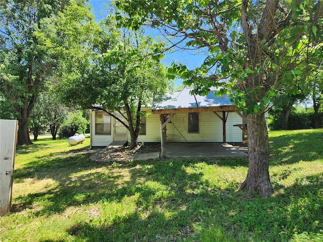 10809 Wayne Route Ff, Patterson, MO 63956 - back of house featuring a yard and a patio area