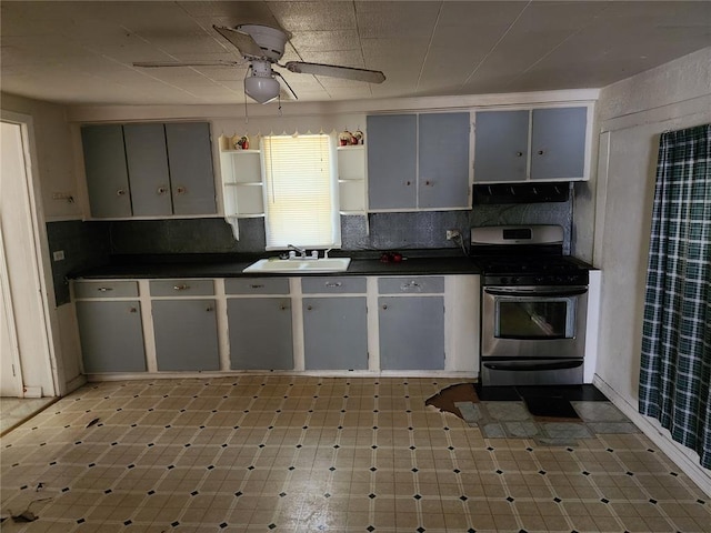 10809 Wayne Route Ff, Patterson, MO 63956 - kitchen featuring stainless steel gas stove, dark countertops, open shelves, and ceiling fan