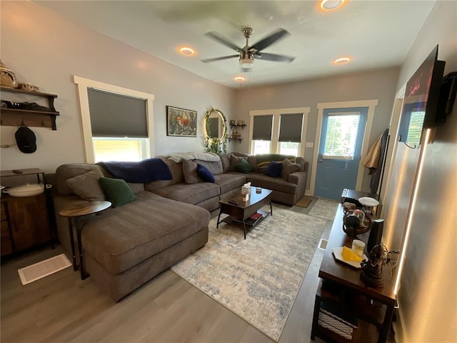 1509 Booker St, Hannibal, MO 63401 - living area featuring light wood-style flooring, a ceiling fan, and recessed lighting