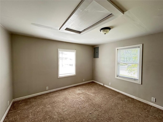 500 S Warfel St, Salem, MO 65560 - unfurnished room featuring attic access, electric panel, carpet flooring, and baseboards