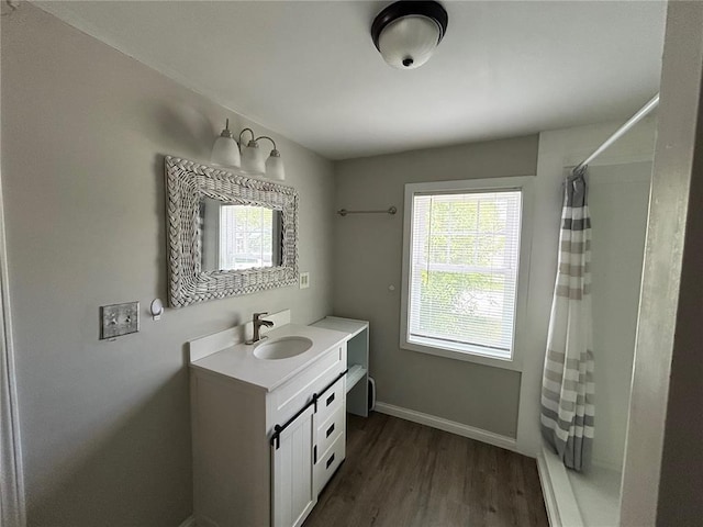 500 S Warfel St, Salem, MO 65560 - bathroom with vanity, wood finished floors, and baseboards